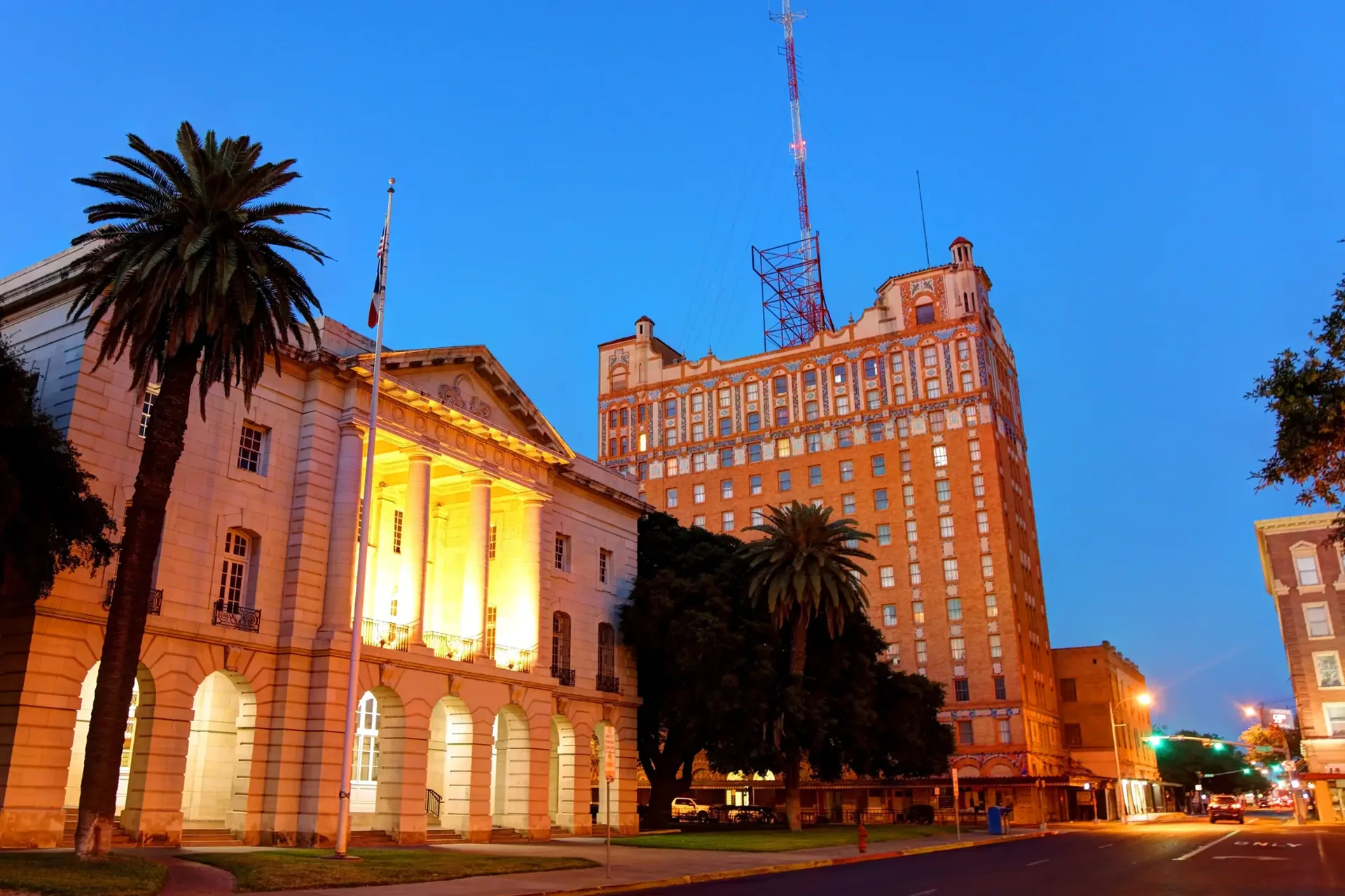 Downtown Laredo civic buildings and palm trees at blue hour